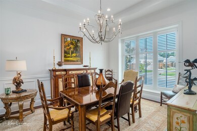 Dining space featuring a notable chandelier and cr