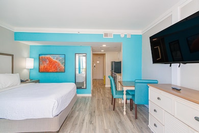 Bedroom with light hardwood / wood-style flooring 