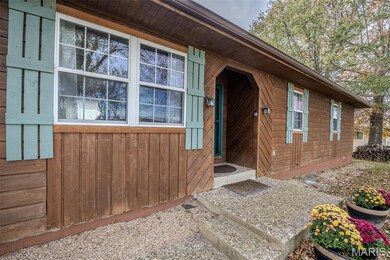 Property entrance with board and batten siding