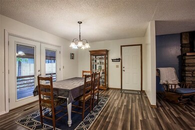 Formal dining area which leads out to the covered back deck and to the carport