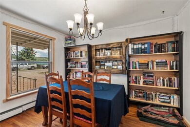 Dining room with a notable chandelier, a baseboard