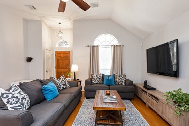 Arched transom windows highlight the wooden door a