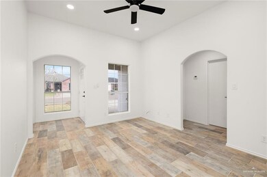 Empty room featuring light hardwood / wood-style floors and ceiling fan