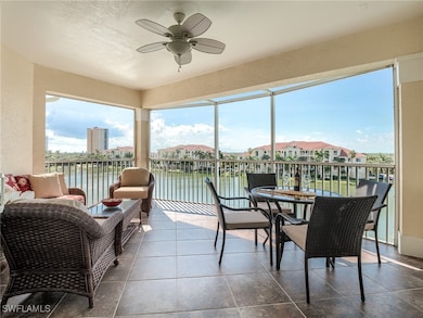 Sunroom with a water view, ceiling fan, and plenty
