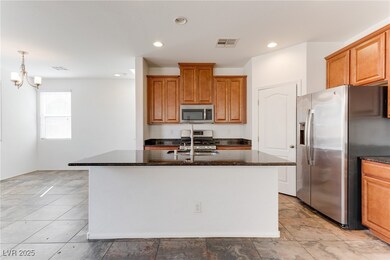 Kitchen featuring visible vents, appliances with s