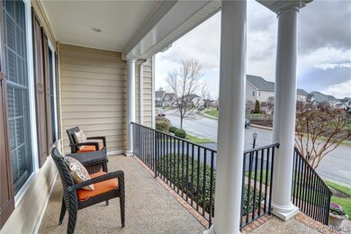 Lovely aggregate and brick front porch bound by co