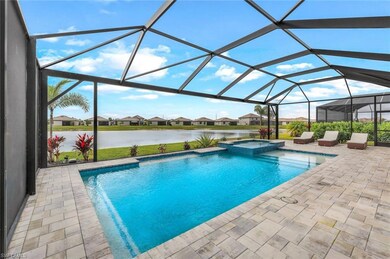 View of swimming pool featuring a water view, an i