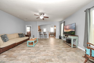 Living room over looking kitchen and primary bedro