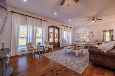 Living room with dark hardwood / wood-style floors