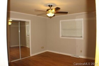 Master bedroom 1 has wood floors, crown molding, en suite bath