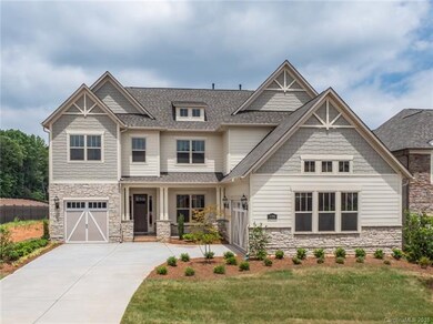 Breathtaking exterior with full landscaping and ir