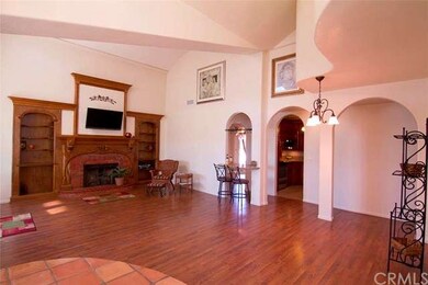 Custom carved maple fireplace mantle flanked by cu