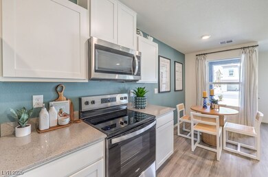 Kitchen with appliances with stainless steel finis