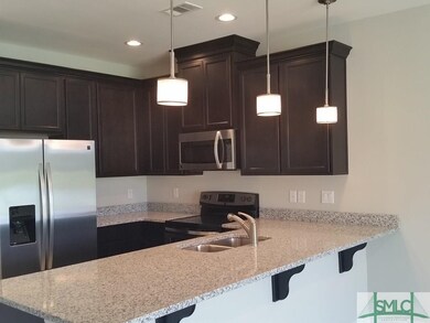 KITCHEN WITH GRANITE COUNTERS AND STAINLESS STEEL 
