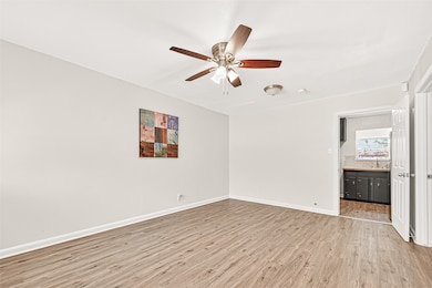 Comfortable living room that opens up into the kitchen! Notice: ZERO carpet!
