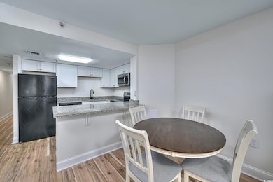 Kitchen with appliances with stainless steel finis