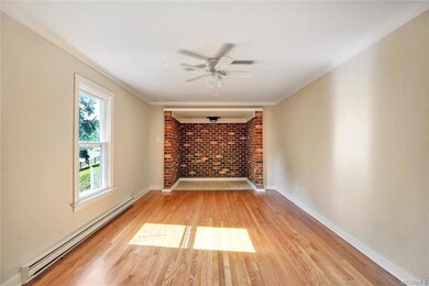 Another view of family room featuring crown moldin