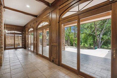 Beautiful wall of windows overlooking the half-acr