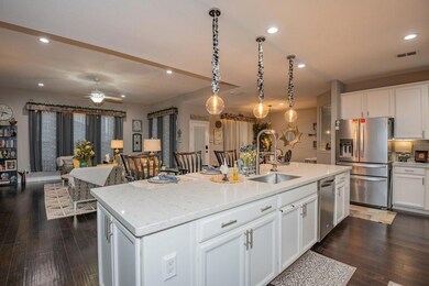 Modern white kitchen with granite counters, storag