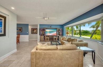 Living room with baseboards and recessed lighting