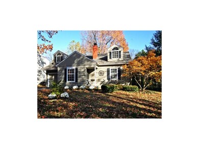 Colorful landscaping accentuate front yard which a