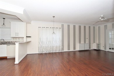 Open kitchen access with beautiful floors.
