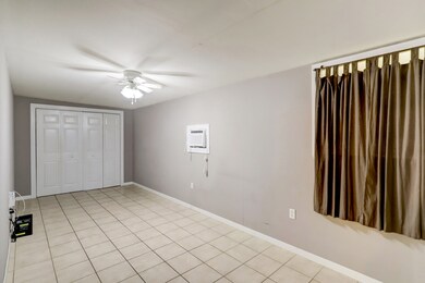 The largest room of the home is tucked away behind the kitchen and breakfast space. Perfect for a private primary, an office space, any flex space you desire! This room was an addition and is not included in the square footage of the home.