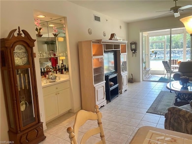 Living room featuring bar area and ent center with