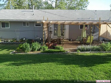 view of back of house showing covered patio