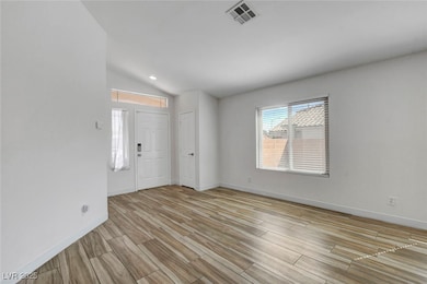 Entryway with wood tiled floors, vaulted ceiling, and recessed lighting