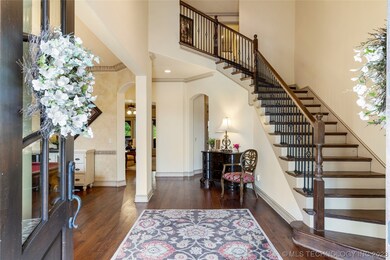 Gorgeous two-story entry is flooded with natural l