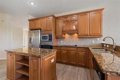 Kitchen view, granite slab counters and stainless 