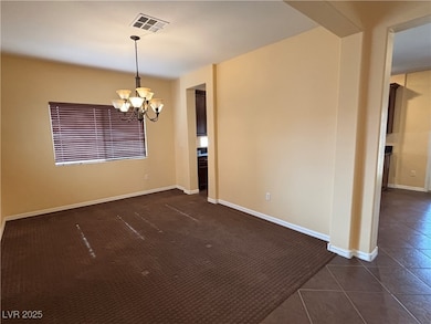 Spare room featuring visible vents, a notable chan