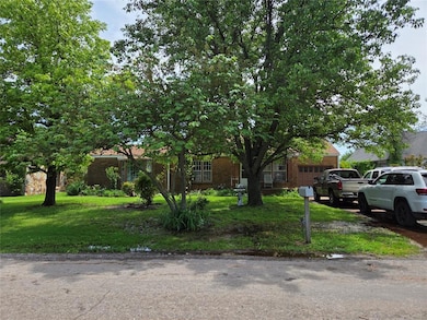 View of property hidden behind natural elements wi