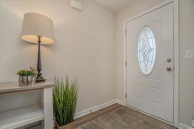 Foyer entrance with hardwood / wood-style flooring