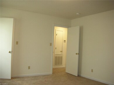 Primary Bedroom: Features include carpet flooring, a window for natural lighting and blinds for privacy and fresh paint. The open door on the left is the closet. When you open the door the closet light goes on automatically. The door to the right side is the entry door from the main hallway.
