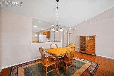 Dining area with an open floor plan featuring a va