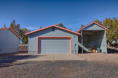 Oversized 2-Car Garage and RV Carport