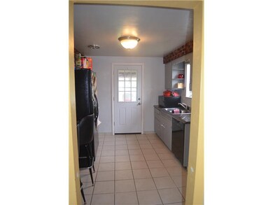 Kitchen. Lovely ceramic tile flooring await you in