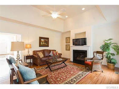 Family room's cathedral ceiling, gas fireplace, an