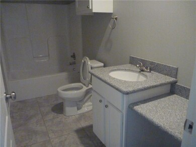 Hall Bath with Granite counter tops, and ceramic t