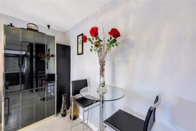 Dining room featuring light tile patterned floorin