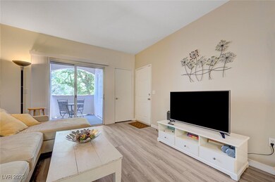 Living room featuring wood finished floors and bas