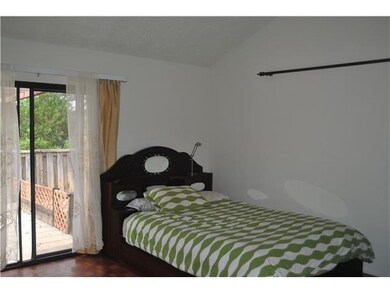 Master bedroom with slider doors to patio area