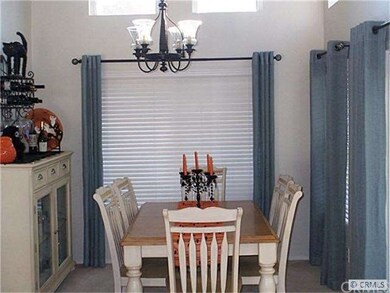 Dining room, looks out over the lush yard.