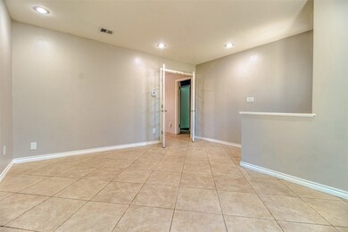 The entry hall off the front door leads guests through gracious French doors into the family room passing by a formal living area overlooking the front gardens that doubles nicely as a home office, library, or music conservatory.