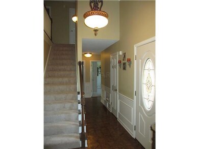 Inviting entry hall with hardwood floors.
