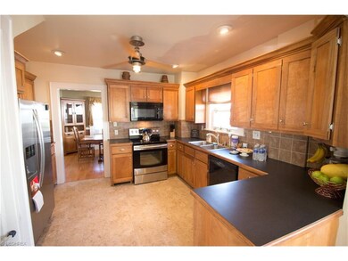 Kitchen features custom cabinets and stainless ste