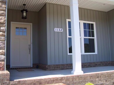 Rocking chair front porch with electrical outlet f