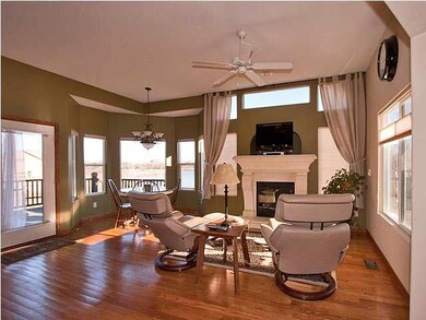 Wood floors, high ceilings, and abundance of windo